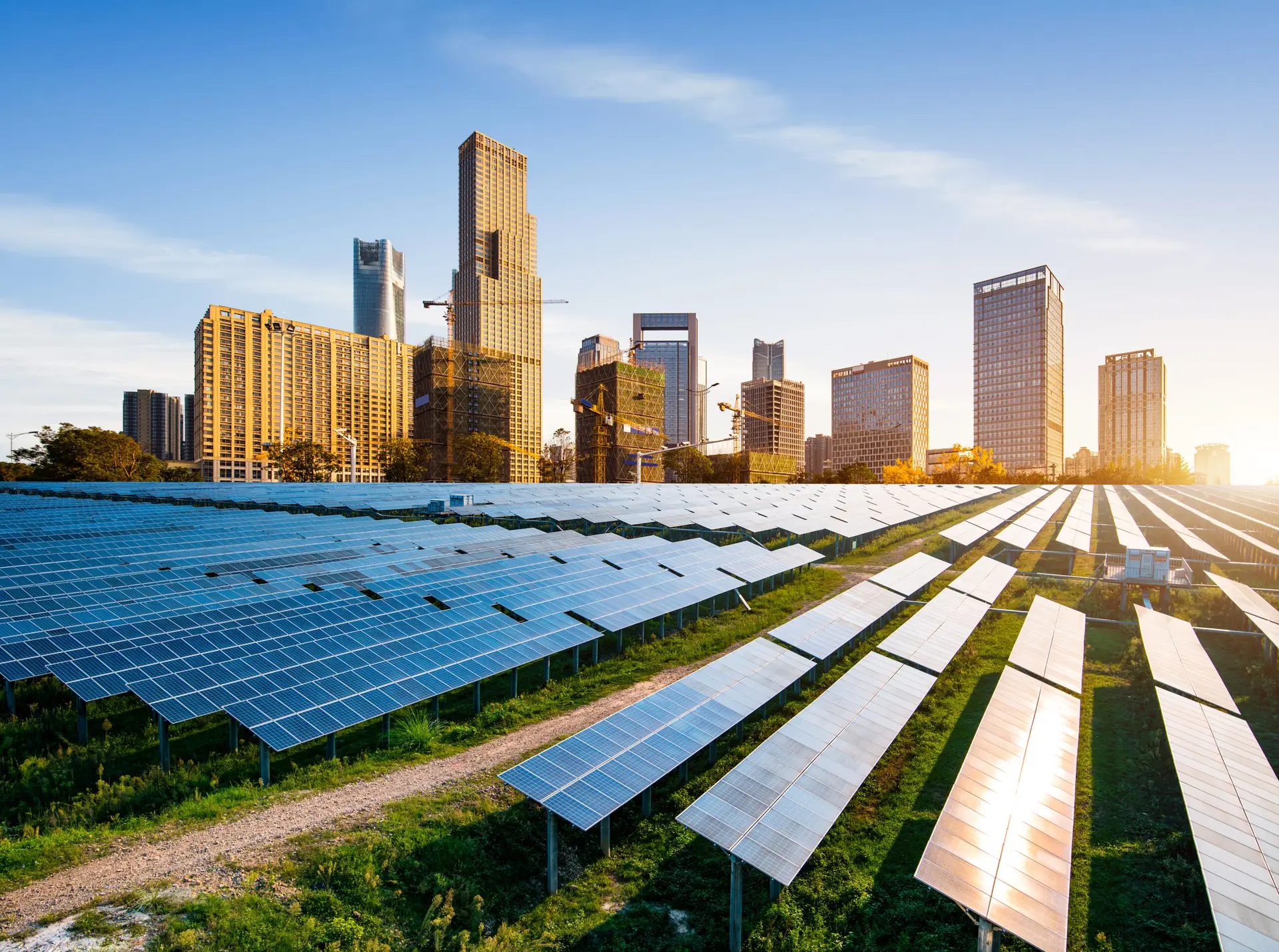 Solar panels in front of a city skyline used to support strategic communication around sustainability and clean energy initiatives
